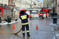 Exercises fire brigade in the old part of the city in the winter. Elimination of fire and natural disasters. Emergency response se Royalty Free Stock Photo