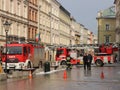 Exercises fire brigade in the old part of the city in the winter. Elimination of fire and natural disasters. Emergency response se Royalty Free Stock Photo