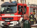 Exercises fire brigade in the old part of the city in the winter. Elimination of fire and natural disasters. Emergency response se Royalty Free Stock Photo