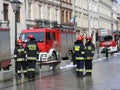 Exercises fire brigade in the old part of the city in the winter. Elimination of fire and natural disasters. Emergency response se Royalty Free Stock Photo