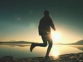 Exercising on the beach at sunset, sun at horizon Royalty Free Stock Photo