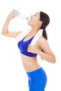 After exercising , pretty woman drinking water Royalty Free Stock Photo