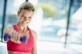 Exercising with a smile. an attractive young woman working out with dumbbells. Royalty Free Stock Photo