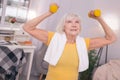 Cheerful senior woman lifting up dumbbells Royalty Free Stock Photo