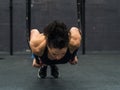 Exercising woman holding gymnast rings Royalty Free Stock Photo