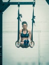 Exercising  woman holding gymnast rings Royalty Free Stock Photo