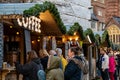 Exeter Christmas market with shoppers buying hot coffee