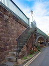 EXETER, DEVON, UK - August 3 2021: Steps leading up to the Iron Bridge roadway viewed from Lower North Street