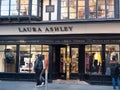 EXETER, DEVON, UK - December 03 2019: Laura Ashley store front on Exeter High Street. Pedestrians walk by and look in the shop win