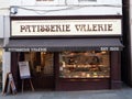 EXETER, DEVON, UK - December 03 2019: Patisserie Valerie shop front on Exeter High Street with cakes and fine pastries displayed