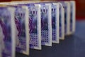 EXETER, ENGLAND - DECEMBER 20TH 2019: A row of twenty pound Sterling notes stands on a black background. Only the middle note is Royalty Free Stock Photo