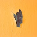 Exfoliated orange paint. Paint on metal surface. Close up