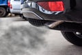 Exhaust from black car , air pollution concept Royalty Free Stock Photo