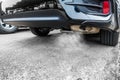 Exhaust from black car , air pollution concept Royalty Free Stock Photo