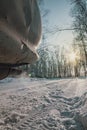 Exhaust gases of a car in nature in a winter birch forest