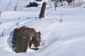 Tractor buried in the snow after a blizzard