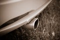 Exhaust pipe in a yellow sports car. Royalty Free Stock Photo