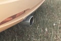 Exhaust pipe in a yellow sports car. Royalty Free Stock Photo