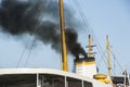 Exhaust smoke from a ship smoke stack Royalty Free Stock Photo