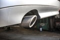 The exhaust system in the diesel car seen up close, view from rear of muffler. Royalty Free Stock Photo