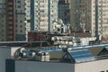 Exhaust vents of industrial air conditioning and ventilation units. Skyscraper roof top in Tokyo, Japan. Royalty Free Stock Photo