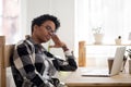 African American girl feel bored sitting at workplace Royalty Free Stock Photo