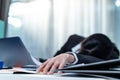 Exhausted Asian business woman office worker nap on desk at workplace. Busy Employee worker girl feel tired of many paper work, Royalty Free Stock Photo