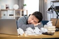 Exhausted asian businessman sleeping on table, after hard work from home Royalty Free Stock Photo