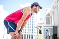 Exhausted athlete leaning forward after an effort