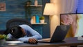 Exhausted black businesswoman falling asleep on desk Royalty Free Stock Photo