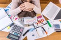 Exhausted business analyst sleeps on her workplace