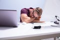 Exhausted Businessman Sleeping On Desk Royalty Free Stock Photo