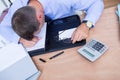 Exhausted businessman sleeping on the desk Royalty Free Stock Photo