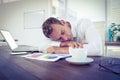 Exhausted businessman sleeping on the desk Royalty Free Stock Photo