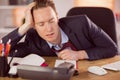 Exhausted businessman sleeping at his desk Royalty Free Stock Photo