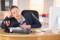 Exhausted businessman sleeping at his desk Royalty Free Stock Photo
