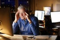 Exhausted businessman working late night Royalty Free Stock Photo