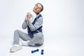 Exhausted Caucasian Sportswoman Wiping Her Forehead with White Towel After Physical Training With Barbells Royalty Free Stock Photo