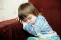 Exhausted child sleeping on chair, tired kid fall asleep Royalty Free Stock Photo