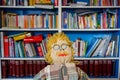 Exhausted Crocheted Male Engineer Doll: Blond Curls, Mustache, Plaid Shirt, and Glasses - Ingenious Concept Image of a Fatigued Royalty Free Stock Photo