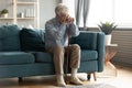 Exhausted disabled middle aged old man leaning on walking cane. Royalty Free Stock Photo