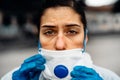Exhausted doctor/nurse wearing coronavirus protective gear N95 mask uniform.Coronavirus Covid-19 outbreak.Mental stress of Royalty Free Stock Photo