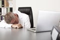 Exhausted doctor sleeping on his desk Royalty Free Stock Photo