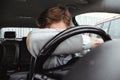 Exhausted driver resting on steering wheel Royalty Free Stock Photo