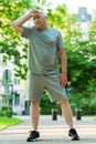 Exhausted elderly man after his jogging workout