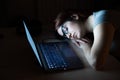 The exhausted employee worked overtime and fell asleep at his desk. Deadline Work at night with a laptop. The student is Royalty Free Stock Photo