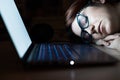 The exhausted employee worked overtime and fell asleep at his desk. Deadline Work at night with a laptop. The student is Royalty Free Stock Photo