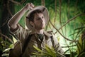 Exhausted explorer in the jungle Royalty Free Stock Photo