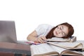 Exhausted girl sleeping on the book Royalty Free Stock Photo