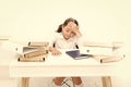 Exhausted girl with workbook and folders. Education. boring lesson. Towards knowledge. small girl on lesson. homework